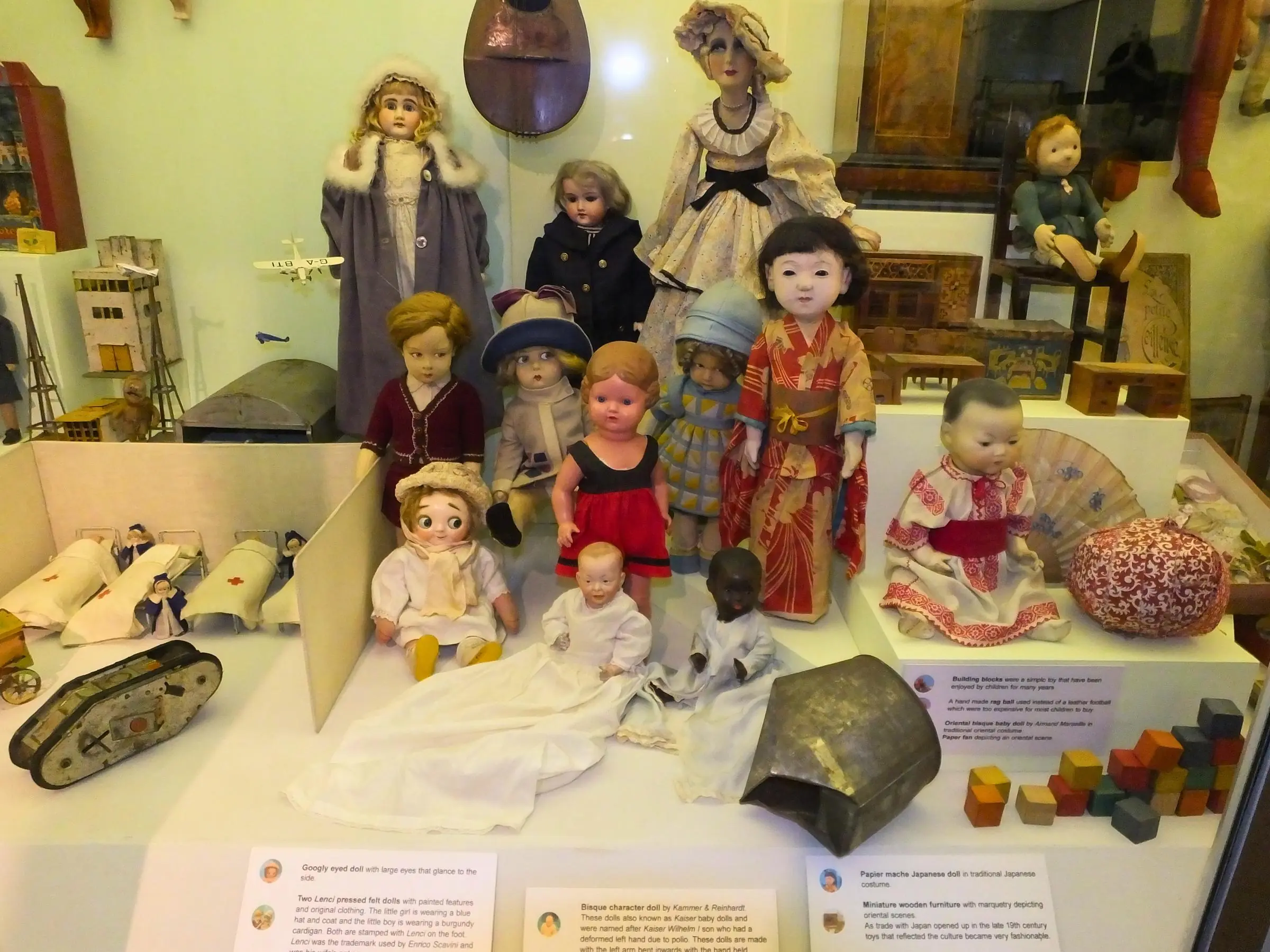 Antique dolls in a glass display case