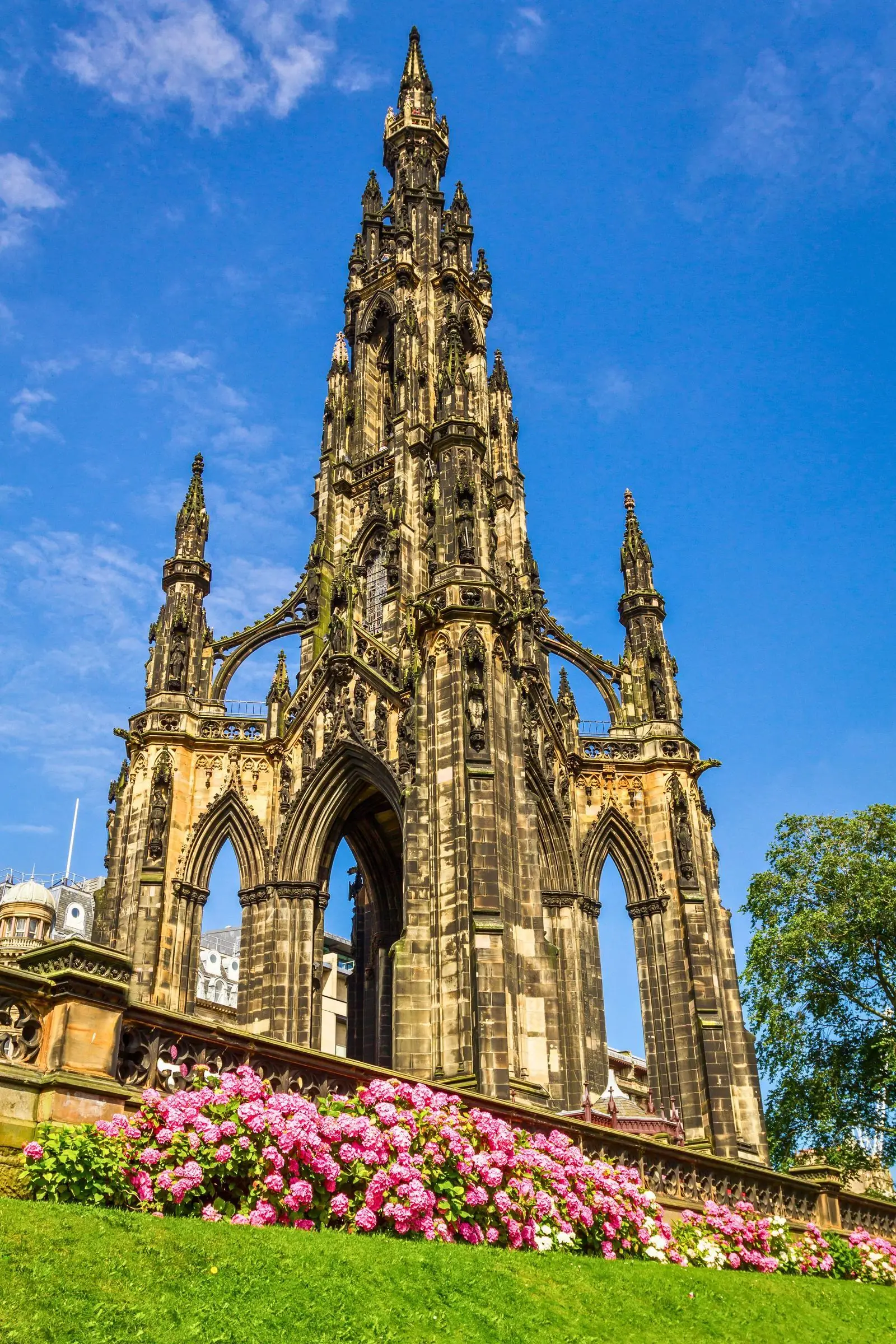 The gothic spire of the Scott Monument towering over Princes Street Gardens in Edinburgh
